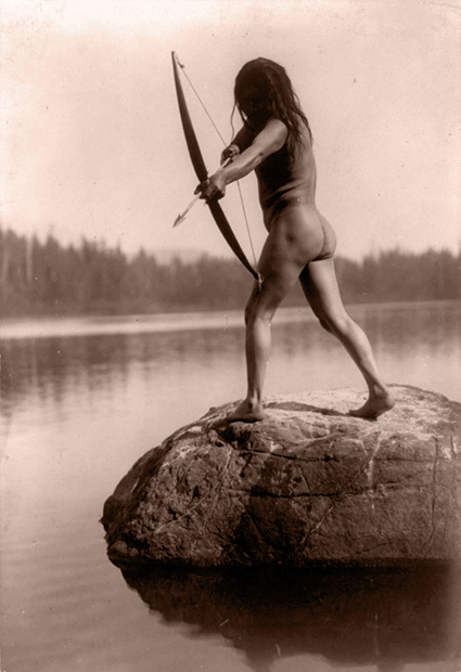 Title: The Bowman--Nootka. Date Created/Published: c1910. Summary: Rear view of nude Indian standing on rock in water and aiming arrow. Photograph by Edward S. Curtis, Curtis (Edward S.) Collection, Library of Congress Prints and Photographs Division Washington, D.C.
